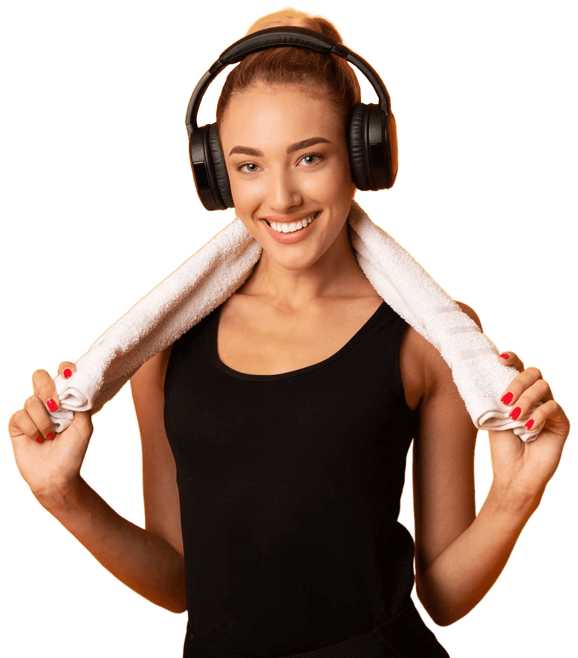 Healthy woman with headphones and towel after workout